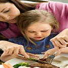 mum cutting daughters food resize